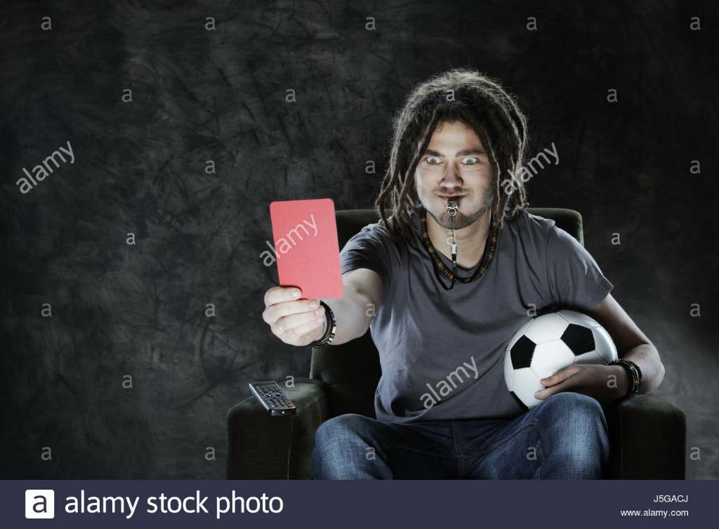referee-watching-the-game-on-the-tv-showing-the-red-card-J5GACJ.jpg